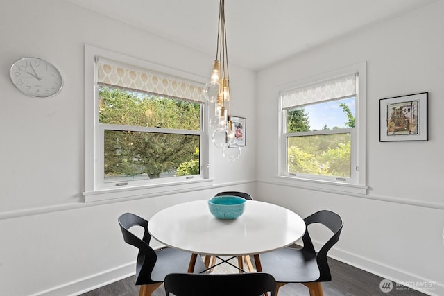1604 28th Ave W, Seattle, WA 98199 - dining room with baseboards and dark wood-style floors