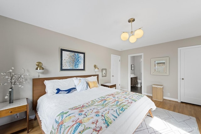1604 28th Ave W, Seattle, WA 98199 - bedroom with wood finished floors and ensuite bathroom