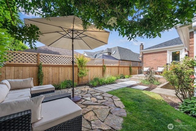 1604 28th Ave W, Seattle, WA 98199 - fenced backyard featuring a patio and outdoor lounge area