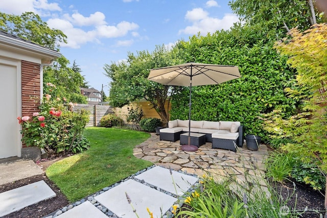 1604 28th Ave W, Seattle, WA 98199 - fenced backyard featuring an outdoor hangout area and a patio