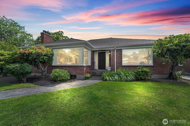 1604 28th Ave W, Seattle, WA 98199 - ranch-style house with brick siding, a front lawn, and a chimney