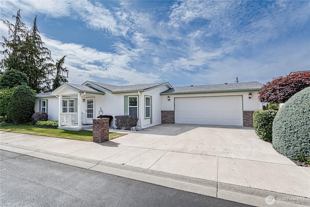 530 Sunday Dr, East Wenatchee, WA 98802 - ranch-style house featuring concrete driveway, an attached garage, and brick siding