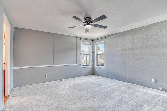 530 Sunday Dr, East Wenatchee, WA 98802 - spare room featuring a textured wall, a ceiling fan, carpet flooring, and a textured ceiling