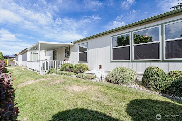 530 Sunday Dr, East Wenatchee, WA 98802 - view of property exterior with a yard and covered porch