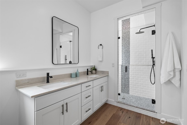 2115 Squak Mountain Loop SW, Issaquah, WA 98027 - full bathroom featuring double vanity, a shower stall, and wood finished floors