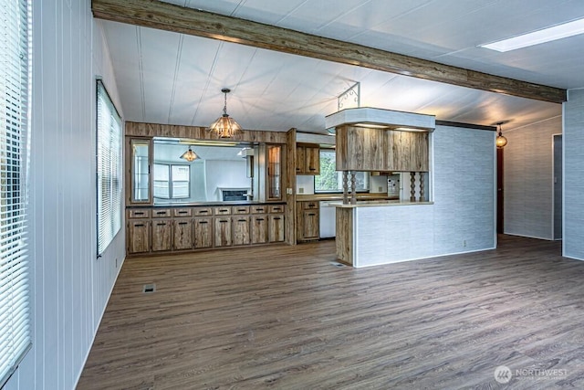 12614 113th Ave E Unit 247, Puyallup, WA 98374 - kitchen featuring dark wood-style flooring, brown cabinetry, dishwasher, and a peninsula