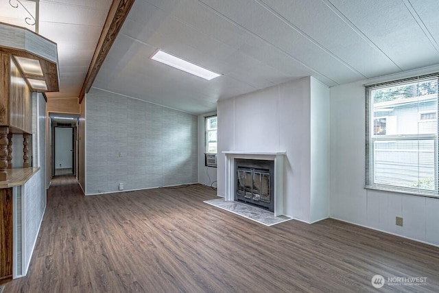 12614 113th Ave E Unit 247, Puyallup, WA 98374 - unfurnished living room featuring wood finished floors, a fireplace with flush hearth, and cooling unit