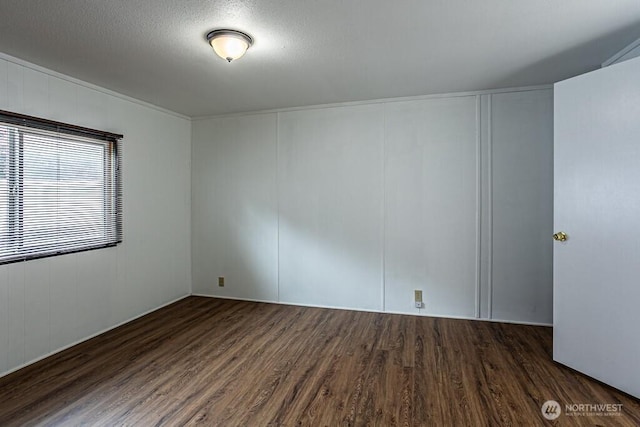 12614 113th Ave E Unit 247, Puyallup, WA 98374 - empty room featuring wood finished floors, a decorative wall, and a textured ceiling