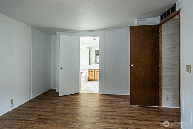 12614 113th Ave E Unit 247, Puyallup, WA 98374 - unfurnished bedroom featuring wood finished floors, a closet, and ensuite bath