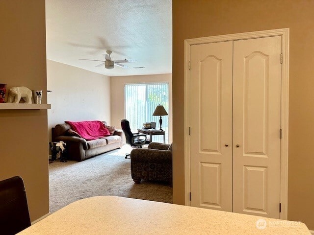 1548 River Rd Unit 105, Longview, WA 98632 - carpeted living room featuring ceiling fan