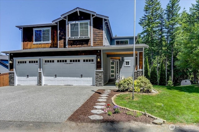 13131 287th Ave SE, Monroe, WA 98272 - view of front of house featuring a garage, stone siding, asphalt driveway, and a front lawn