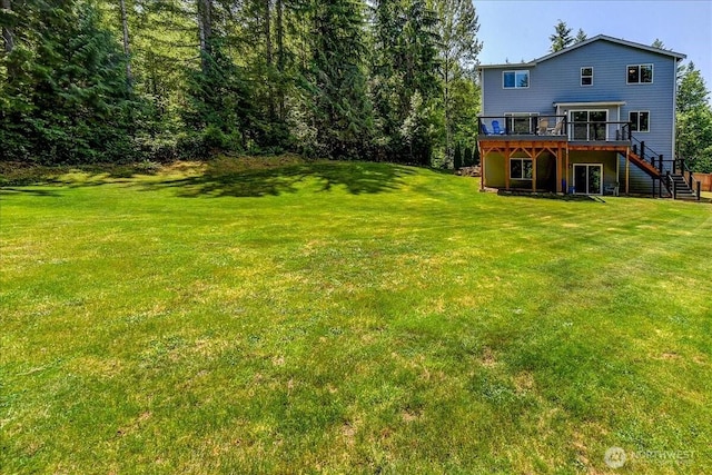 13131 287th Ave SE, Monroe, WA 98272 - view of green lawn with stairway and a deck