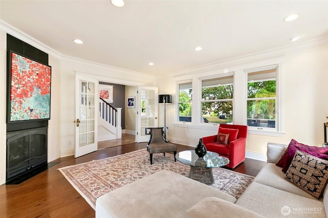1634 Palm Ave SW, Seattle, WA 98116 - living room featuring stairway, crown molding, wood finished floors, and recessed lighting