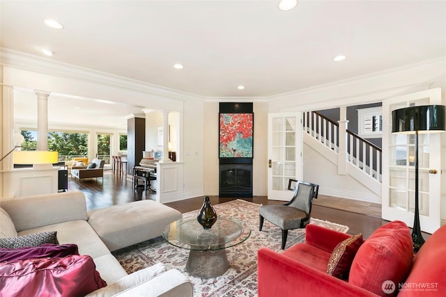 1634 Palm Ave SW, Seattle, WA 98116 - living room featuring decorative columns, crown molding, recessed lighting, and stairway
