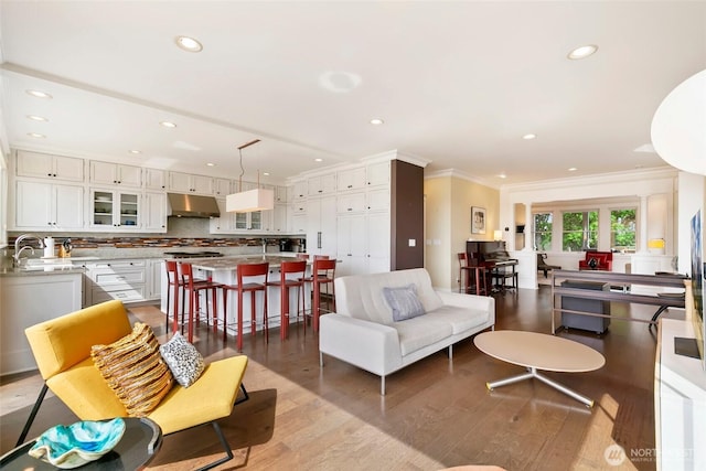 1634 Palm Ave SW, Seattle, WA 98116 - living area with crown molding, light wood-type flooring, and recessed lighting
