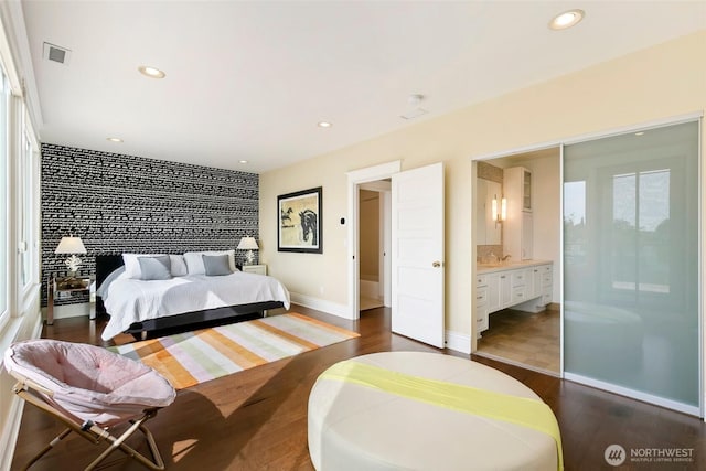 1634 Palm Ave SW, Seattle, WA 98116 - bedroom with dark wood-style floors, recessed lighting, and connected bathroom
