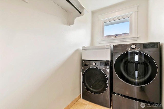 1634 Palm Ave SW, Seattle, WA 98116 - laundry room with washing machine and clothes dryer and light tile patterned floors