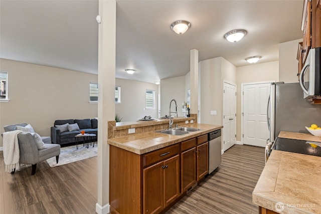 4444 Edgewater Blvd NE, Lacey, WA 98516 - kitchen featuring stainless steel appliances, dark wood finished floors, light countertops, and open floor plan