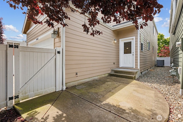 4444 Edgewater Blvd NE, Lacey, WA 98516 - property entrance with a gate, a garage, and a patio