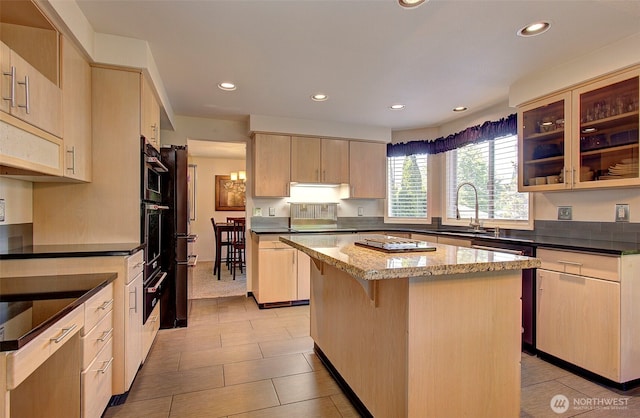 15108 NE 22nd Ave, Salmon Creek, WA 98686 - kitchen with a kitchen island, light brown cabinetry, recessed lighting, dark stone countertops, and a breakfast bar area