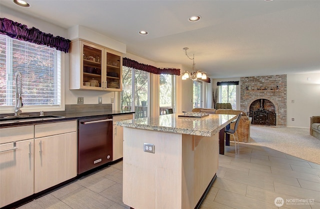 15108 NE 22nd Ave, Salmon Creek, WA 98686 - kitchen featuring stainless steel dishwasher, open floor plan, a kitchen island, glass insert cabinets, and light stone counters