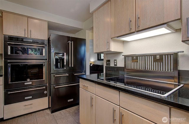 15108 NE 22nd Ave, Salmon Creek, WA 98686 - kitchen featuring high end fridge, a warming drawer, light brown cabinetry, and dark stone counters