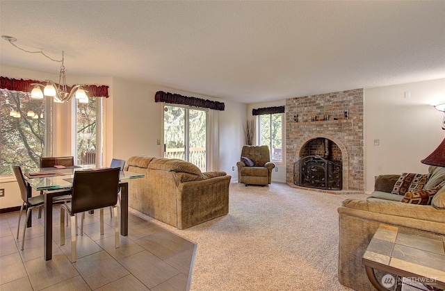 15108 NE 22nd Ave, Salmon Creek, WA 98686 - living room featuring a fireplace, a textured ceiling, and a chandelier