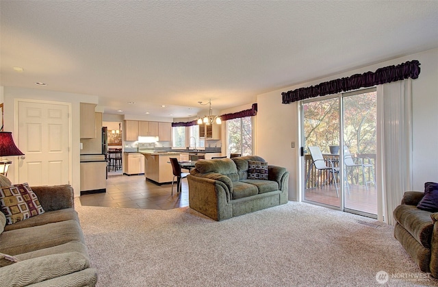 15108 NE 22nd Ave, Salmon Creek, WA 98686 - living room featuring a chandelier, recessed lighting, light colored carpet, and light tile patterned flooring