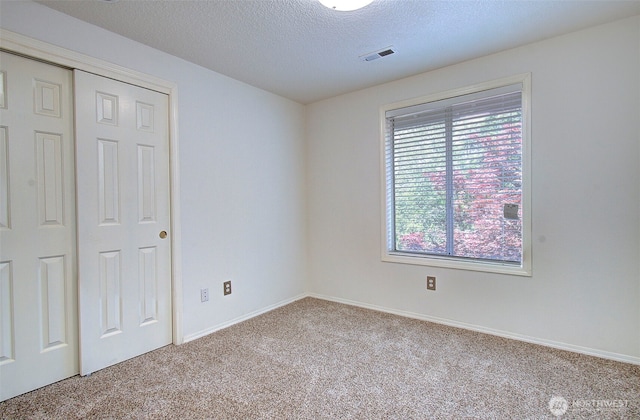 15108 NE 22nd Ave, Salmon Creek, WA 98686 - unfurnished bedroom featuring carpet flooring, a closet, and a textured ceiling
