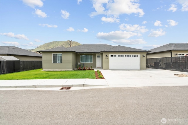 1828 Kristina Ln, Wenatchee, WA 98801 - view of front of house featuring a garage and concrete driveway