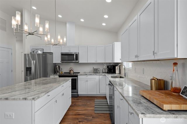1828 Kristina Ln, Wenatchee, WA 98801 - kitchen featuring appliances with stainless steel finishes, a chandelier, a kitchen island, recessed lighting, and white cabinetry