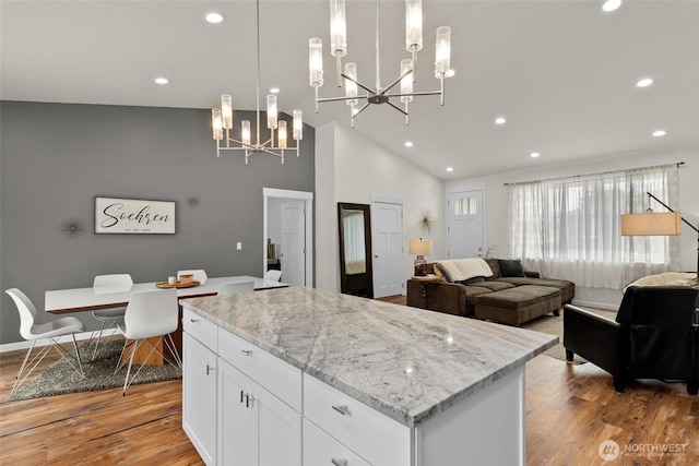 1828 Kristina Ln, Wenatchee, WA 98801 - kitchen featuring a chandelier, light wood finished floors, white cabinetry, recessed lighting, and a center island