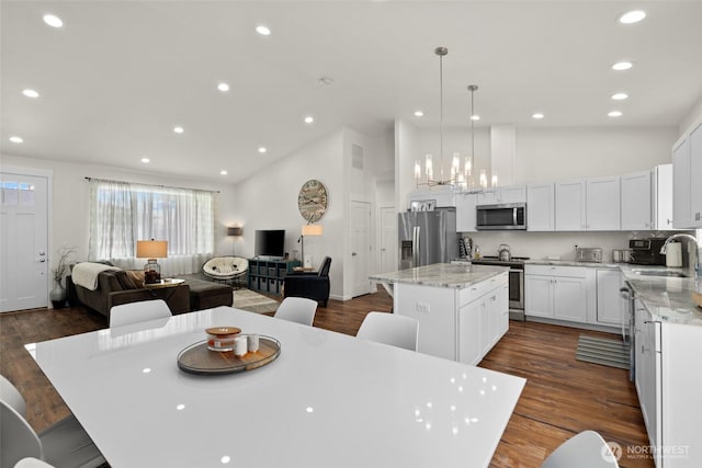 1828 Kristina Ln, Wenatchee, WA 98801 - dining area featuring high vaulted ceiling, recessed lighting, dark wood-type flooring, and a chandelier