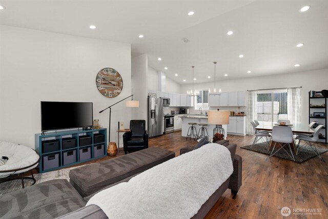 1828 Kristina Ln, Wenatchee, WA 98801 - living room featuring dark wood-style flooring, recessed lighting, and high vaulted ceiling