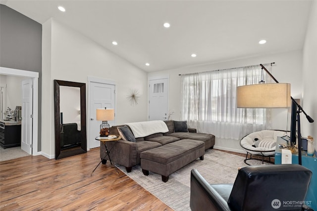 1828 Kristina Ln, Wenatchee, WA 98801 - living room featuring vaulted ceiling, wood finished floors, and recessed lighting