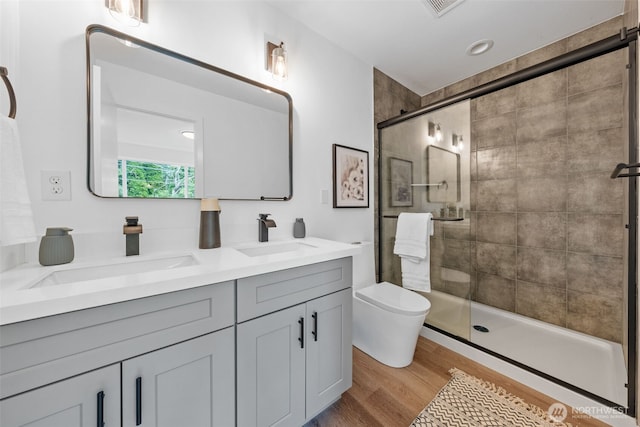 12103 E Gibson Rd, Everett, WA 98204 - bathroom with double vanity, a shower stall, and wood finished floors