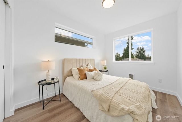 12103 E Gibson Rd, Everett, WA 98204 - bedroom featuring wood finished floors and baseboards