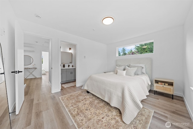 12111 E Gibson, Everett, WA 98204 - bedroom featuring light wood-type flooring, a wall mounted air conditioner, and ensuite bathroom