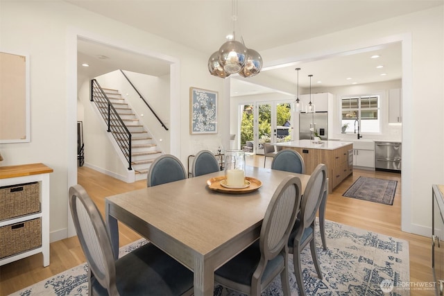2809 NW 71st St, Seattle, WA 98117 - dining room featuring stairs, light wood-style flooring, and recessed lighting