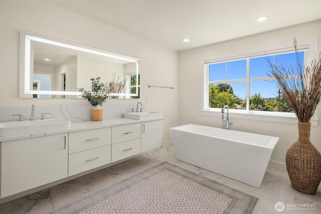 2809 NW 71st St, Seattle, WA 98117 - full bathroom featuring marble finish flooring, double vanity, recessed lighting, and a freestanding bath