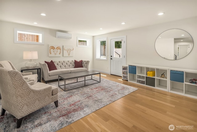 2809 NW 71st St, Seattle, WA 98117 - living area with a wall unit AC, wood finished floors, and recessed lighting