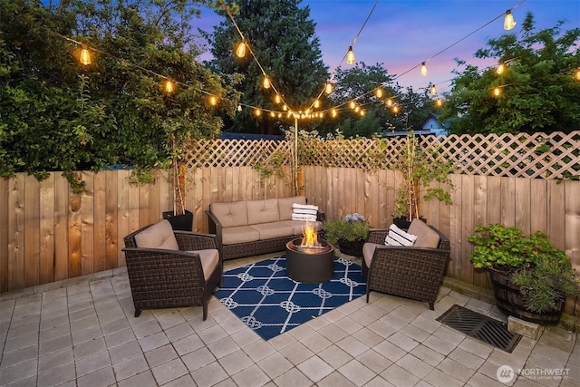 2809 NW 71st St, Seattle, WA 98117 - fenced backyard with an outdoor living space with a fire pit and a patio area
