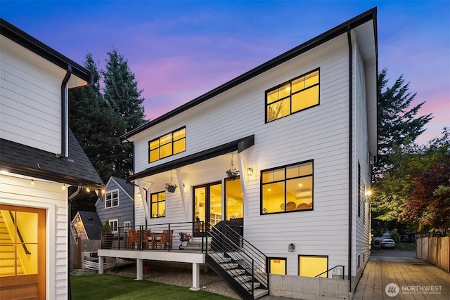 2809 NW 71st St, Seattle, WA 98117 - back of property at dusk featuring a wooden deck