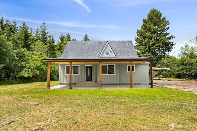 265 Knappton Rd, Naselle, WA 98638 - view of front facade with board and batten siding, a front lawn, and a shingled roof