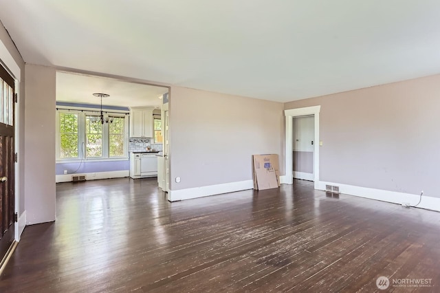 26405 Stephens St, Duvall, WA 98019 - unfurnished living room featuring dark wood finished floors and baseboards