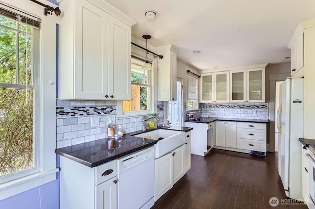 26405 Stephens St, Duvall, WA 98019 - kitchen featuring white appliances, dark wood finished floors, white cabinetry, and tasteful backsplash