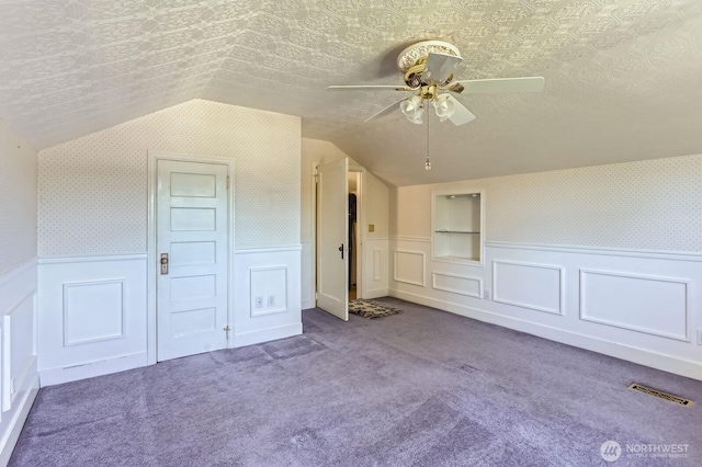 26405 Stephens St, Duvall, WA 98019 - bonus room with vaulted ceiling, a ceiling fan, wainscoting, carpet flooring, and wallpapered walls