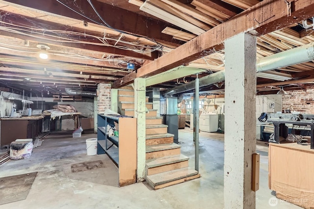 26405 Stephens St, Duvall, WA 98019 - unfinished below grade area featuring washer and clothes dryer and stairs