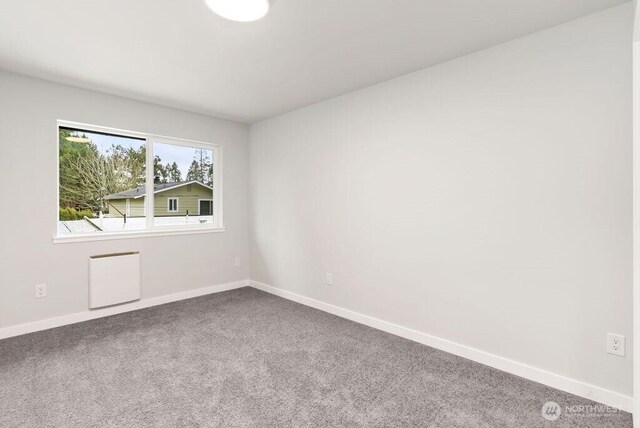 4968 Morgan Dr, Blaine, WA 98230 - empty room with radiator and carpet