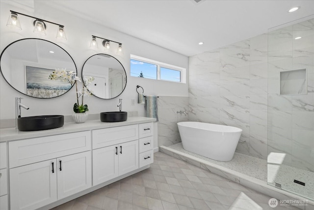 6032 42nd Ave SW Unit A, Seattle, WA 98136 - full bath with double vanity, a freestanding bath, recessed lighting, and a marble finish shower